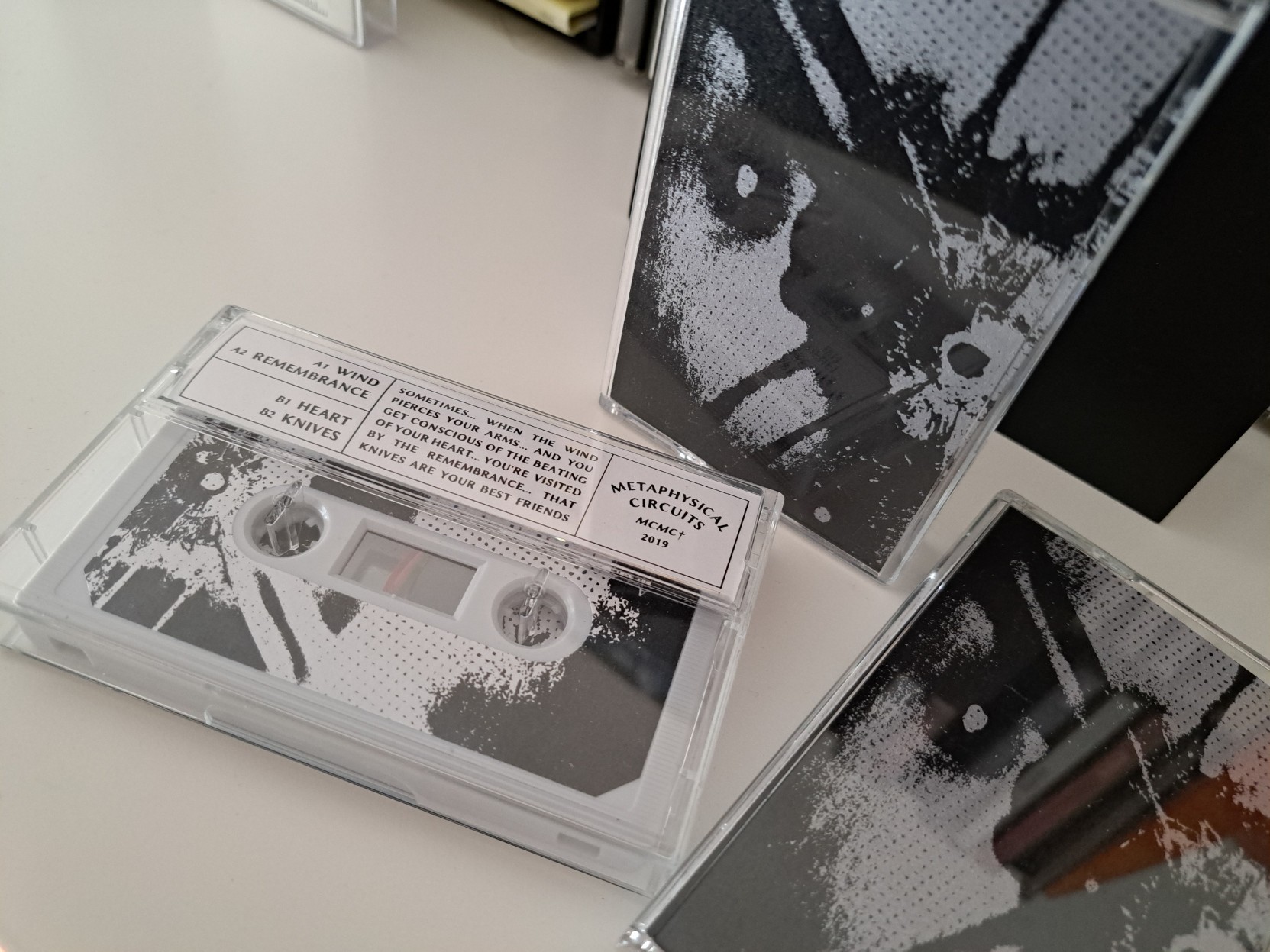 A picture showing three different copies of Qink's tape, in different positions.