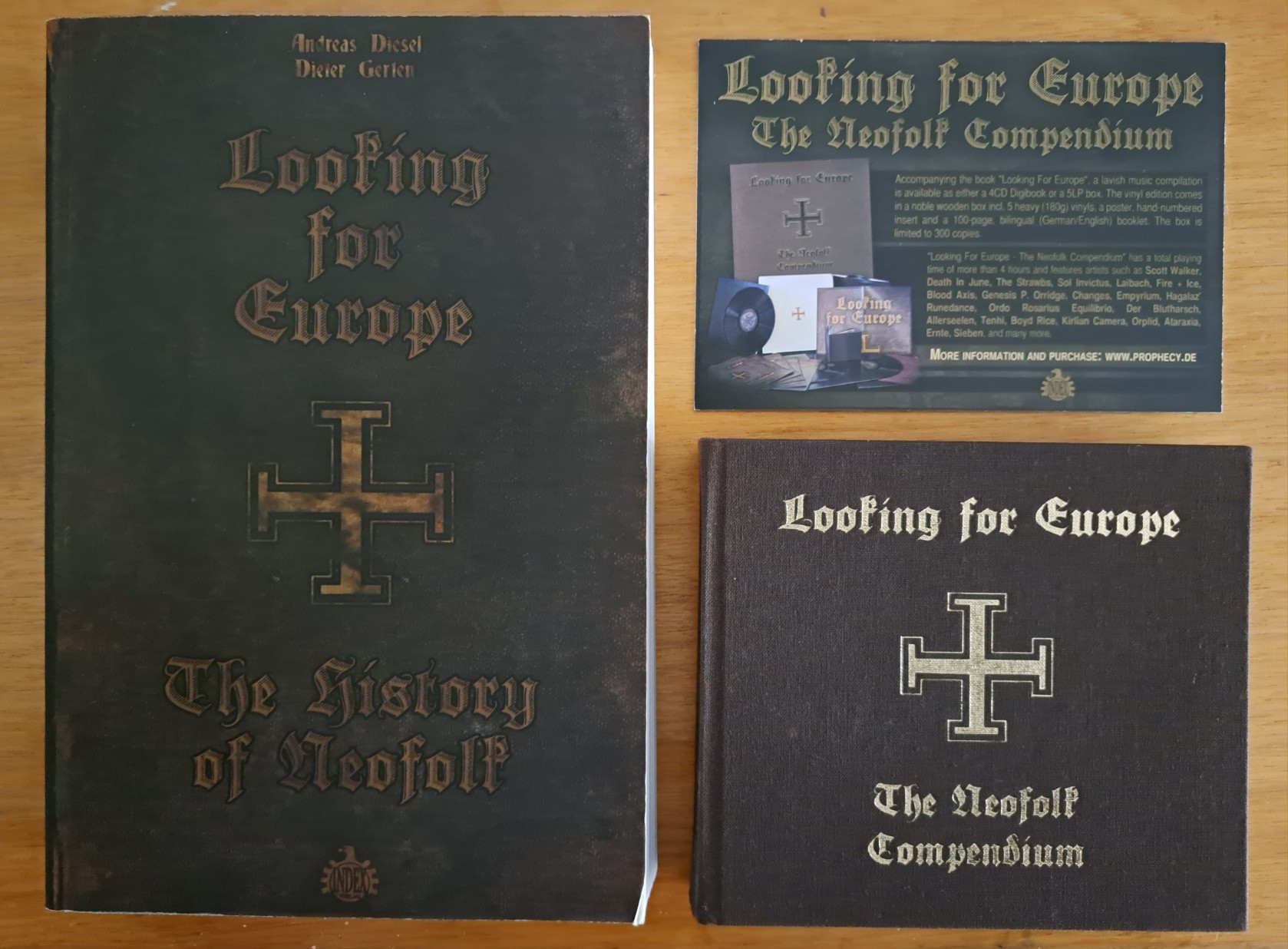 Looking For Europe, the 4CD and 96 pages booklet compilation about neofolk, here sits next to the &ldquo;Looking For Europe - The history of Neofolk&rdquo; book and a postcard promoting the compilation.